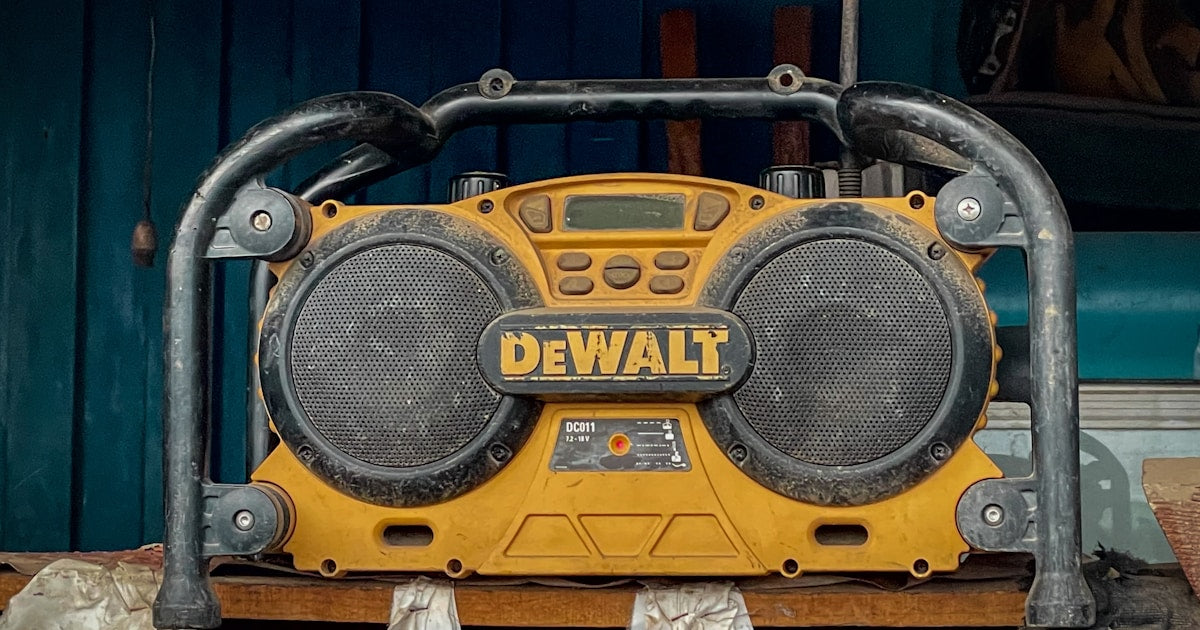 DeWalt power tools and batteries on a professional workbench