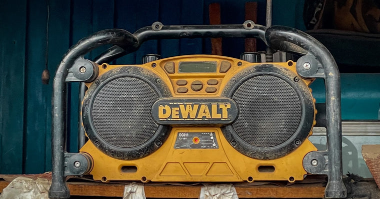 DeWalt power tools and batteries on a professional workbench